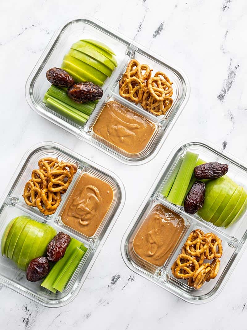 This peanut butter lunch box is an easy no-cook lunch idea for school, work, picnics, or road trips! No reheating needed! Budgetbytes.com Three peanut butter lunch boxes in glass containers