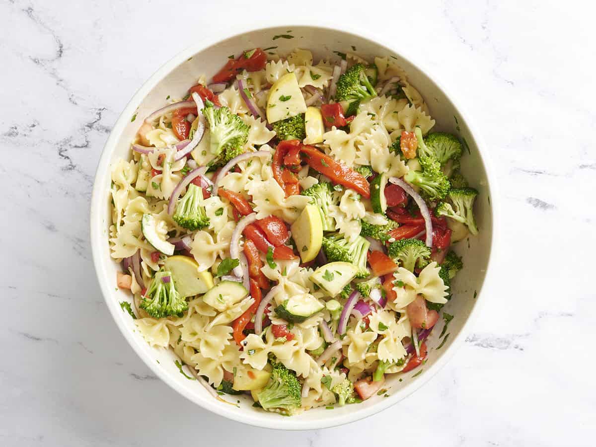 Finished summer vegetable pasta salad in a bowl.