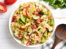 Overhead view of a bowl of summer vegetable pasta salad.