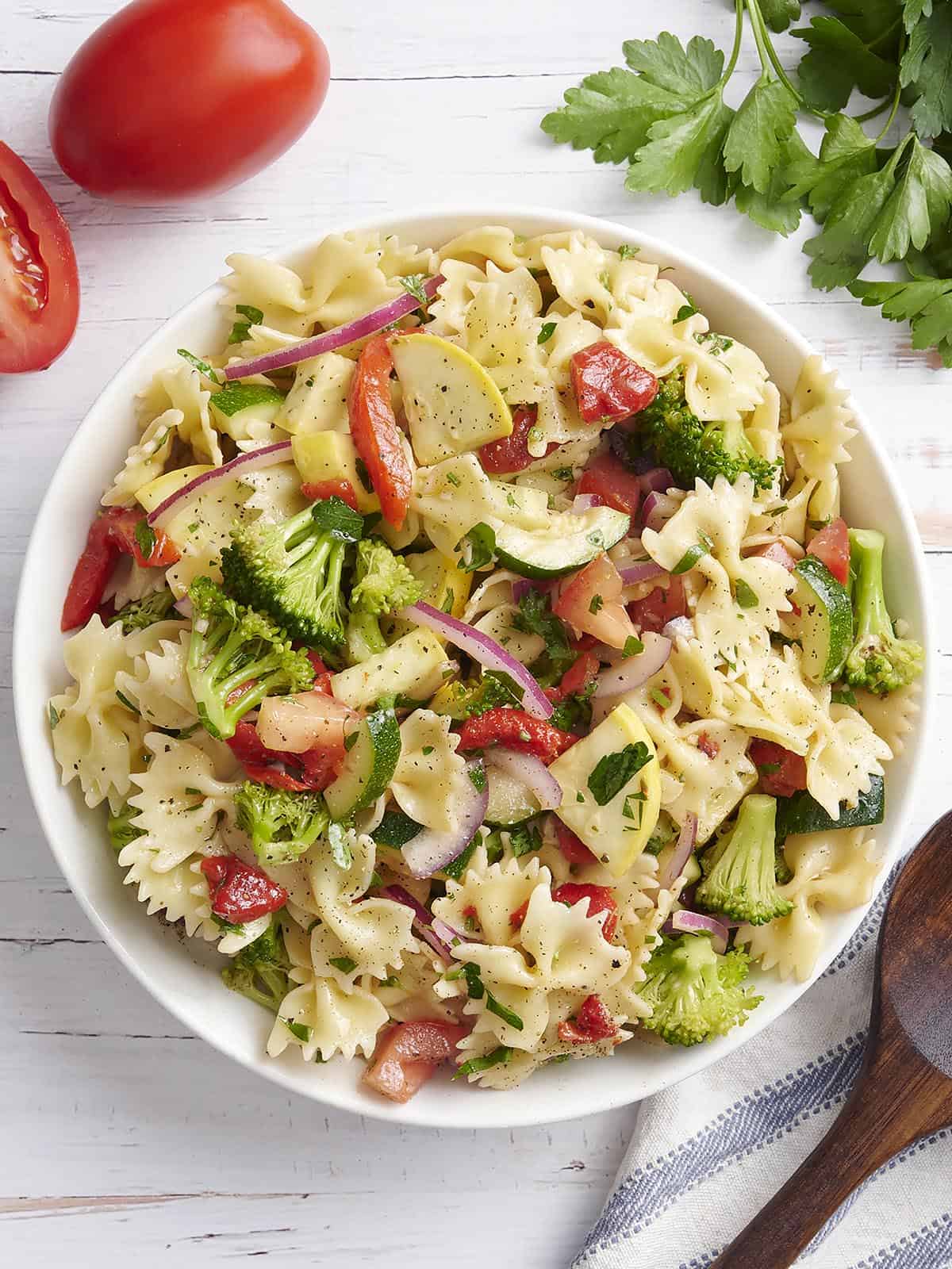 Overhead view of a bowl of summer vegetable pasta salad.