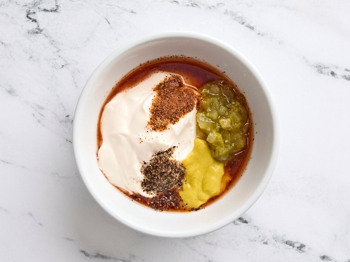 The ingredients for a southern potato salad dressing in a bowl.