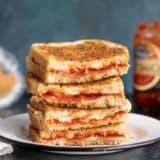 A stack of pizza melts, cut sides facing camera