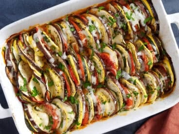 Overhead view of a baking dish filled with layers of oven roasted ratatouille.