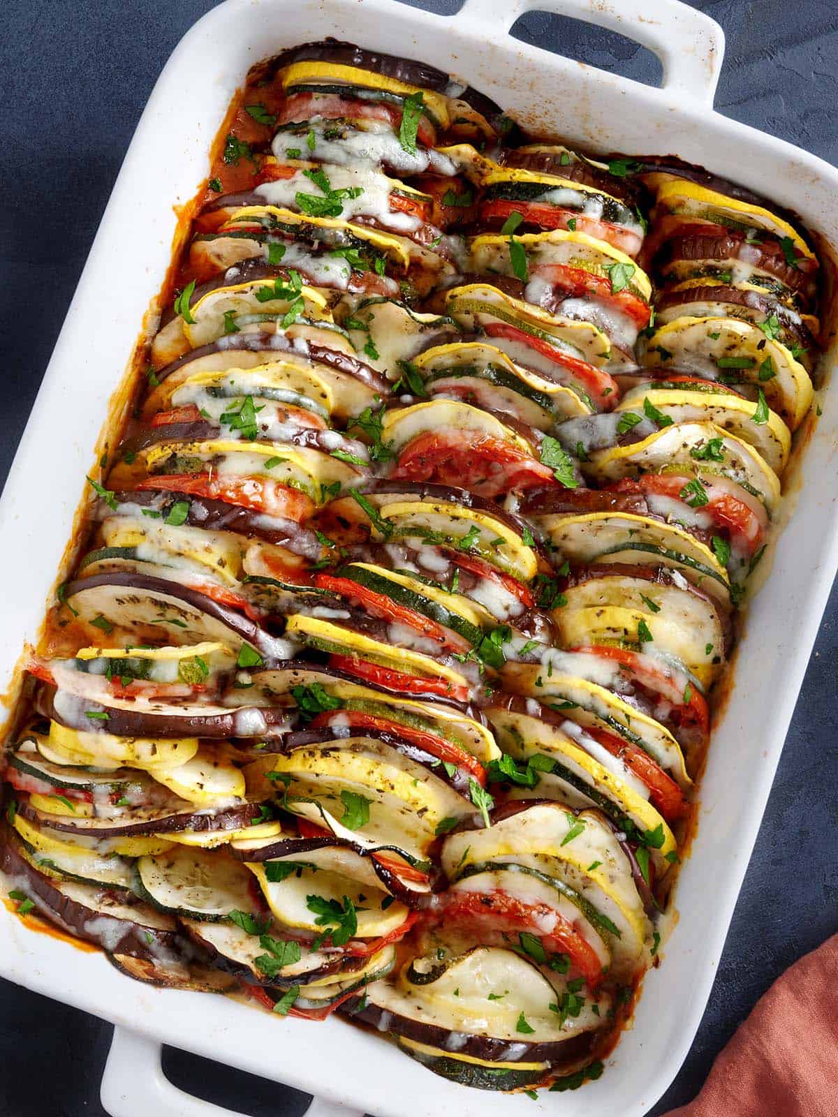 Overhead view of a baking dish filled with layers of oven roasted ratatouille.