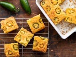 Jalapeño Cheddar Cornbread half in the baking dish and half on a cooling rack
