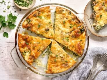 Overhead view of slices of crustless quiche in a dish.