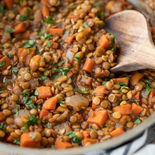 close up side view of spiced lentils in the skillet