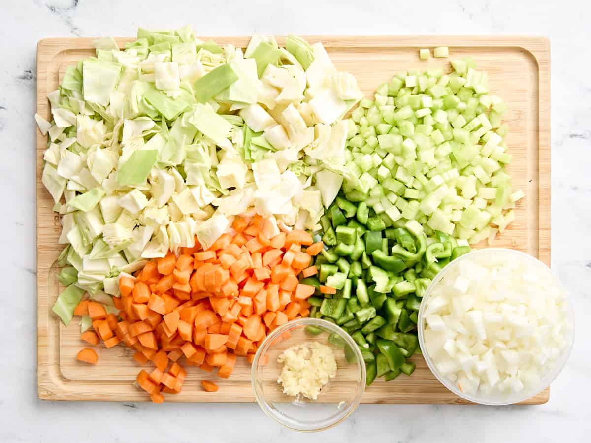 Chopped cabbage, celery, carrots, bell pepper, onion, and minced garlic