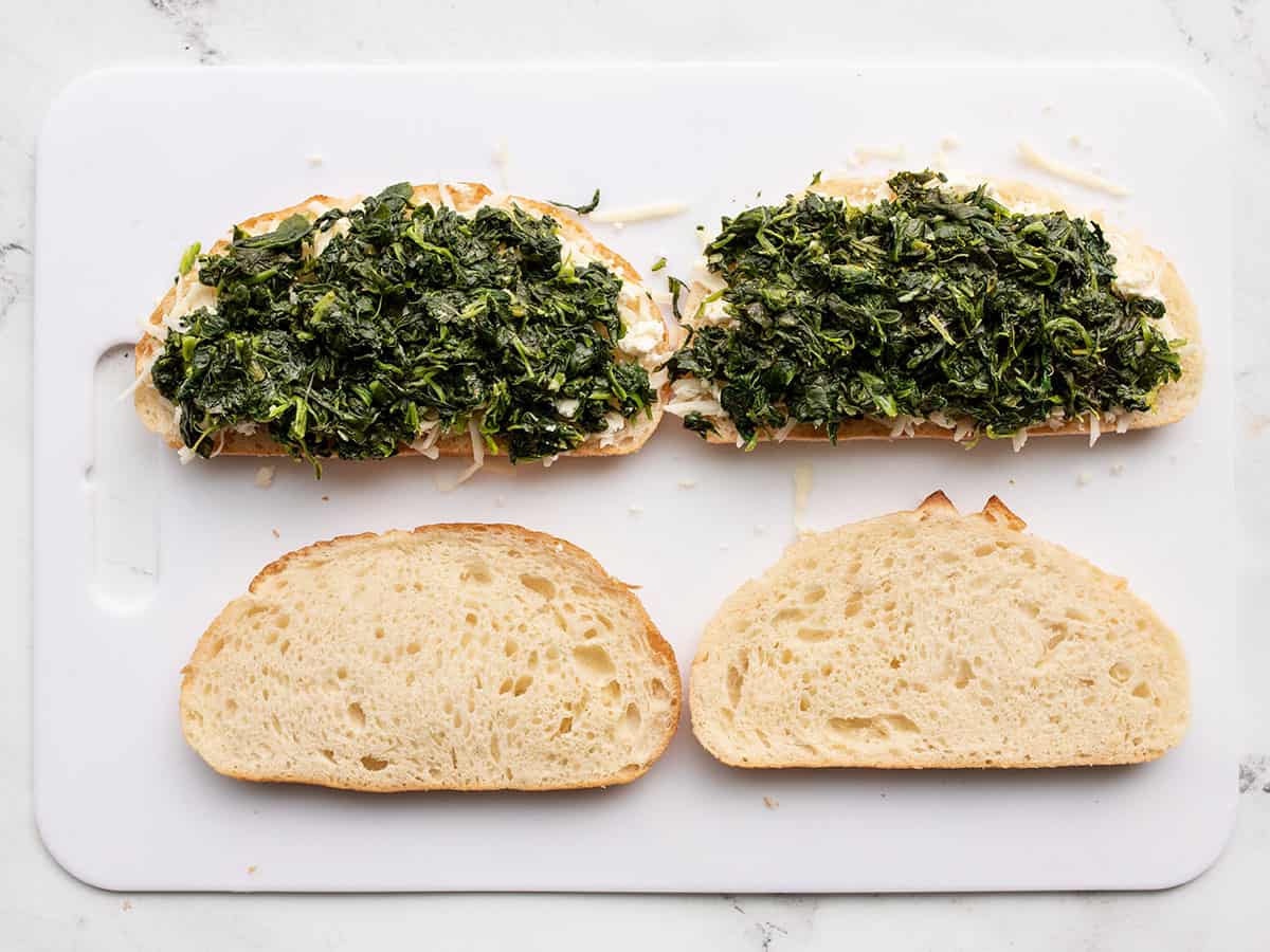 Cooked spinach added to the sandwiches.