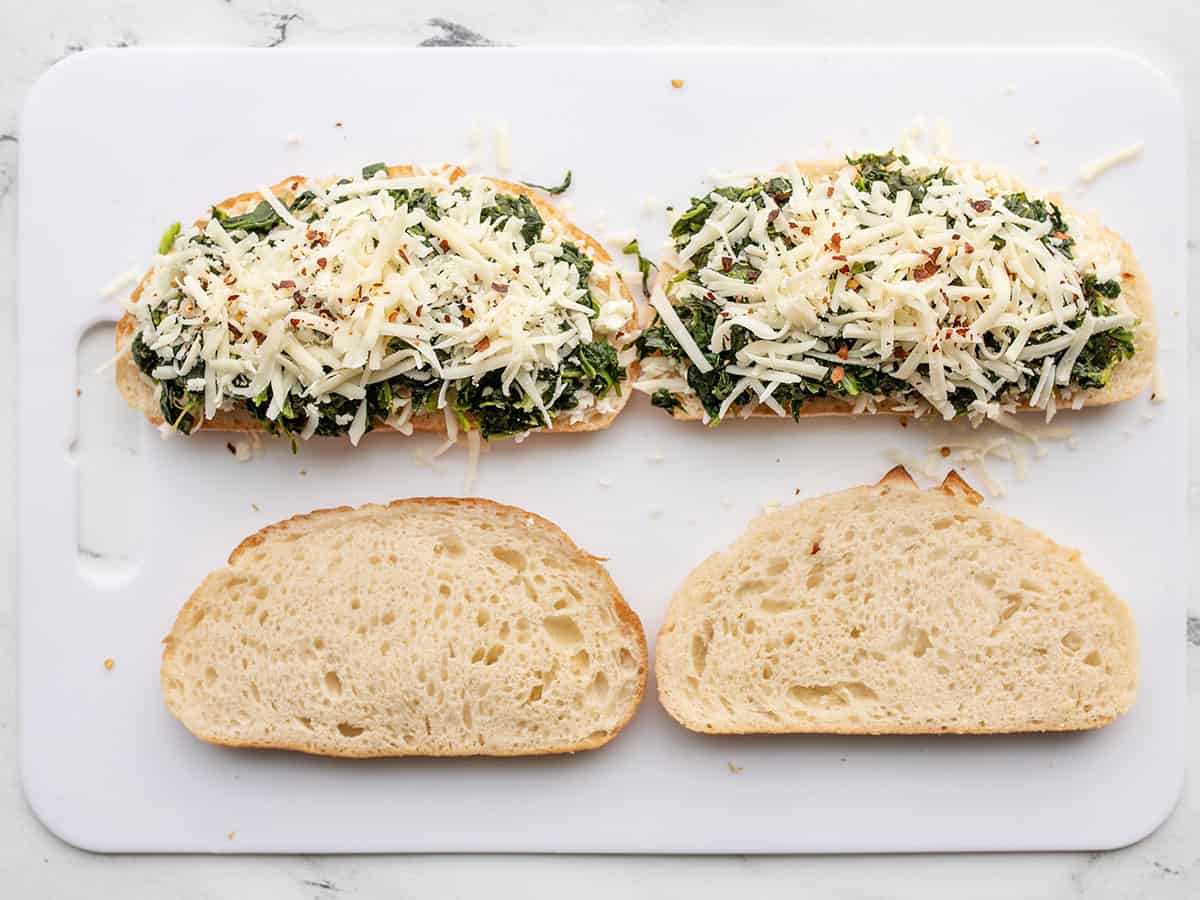 More mozzarella added to the sandwiches.