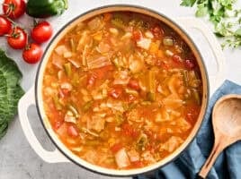 Overhead view of a pot of cabbage soup.