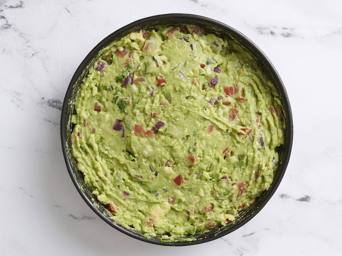 Homemade avocado guacamole in a bowl.