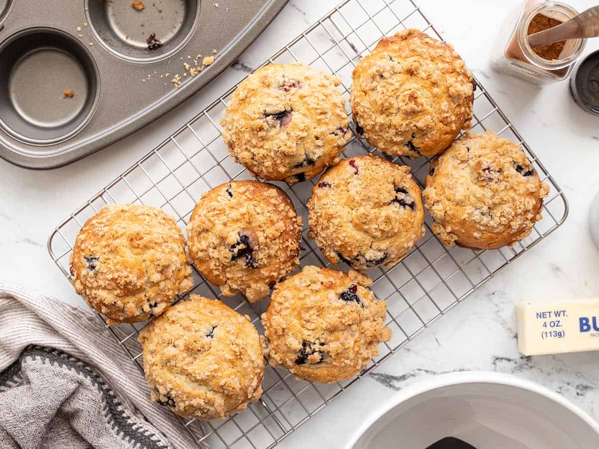 blueberry muffins on a cooling rack from above.