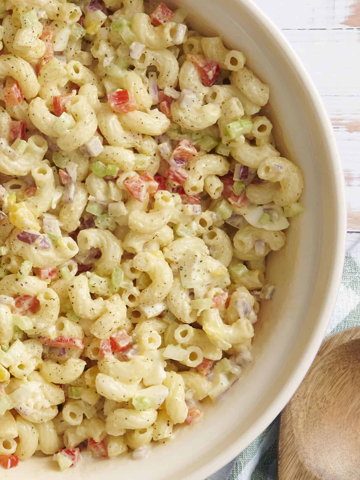 Overhead close up view of a bowl of homemade macaroni salad.