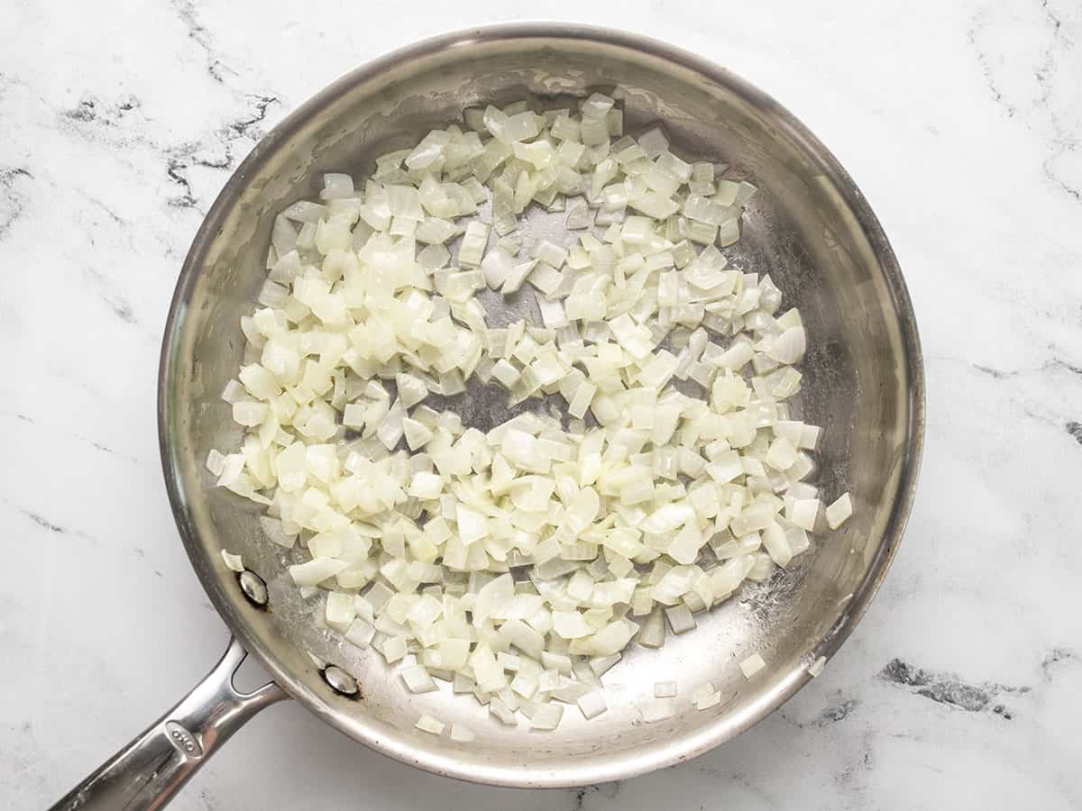 Sautéed onions in a skillet.