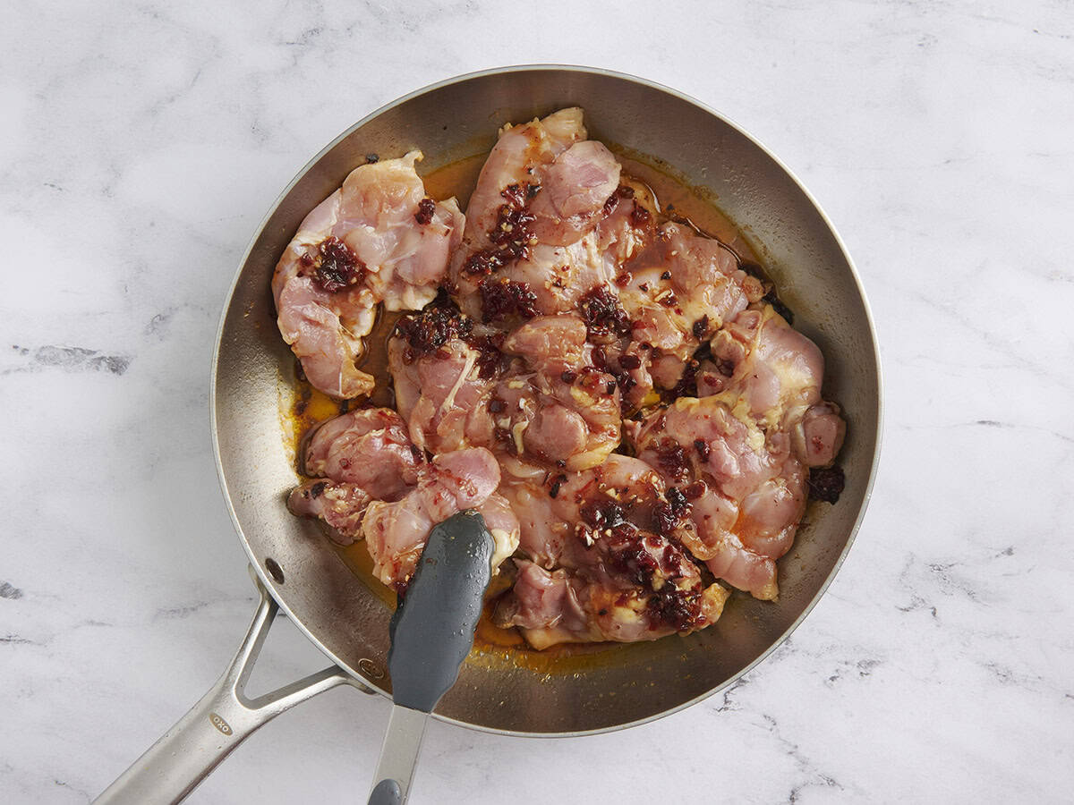 Marinated chipotle chicken in a skillet.