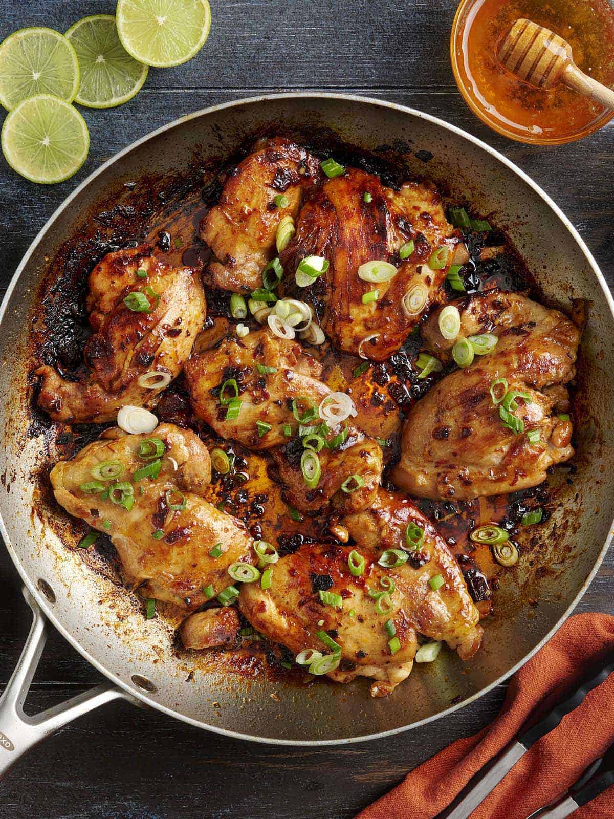 Overhead view of honey chipotle chicken in a skillet.
