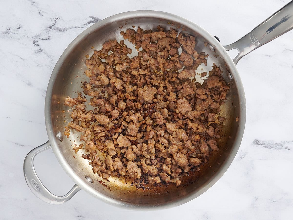Browned sausage in a skillet.