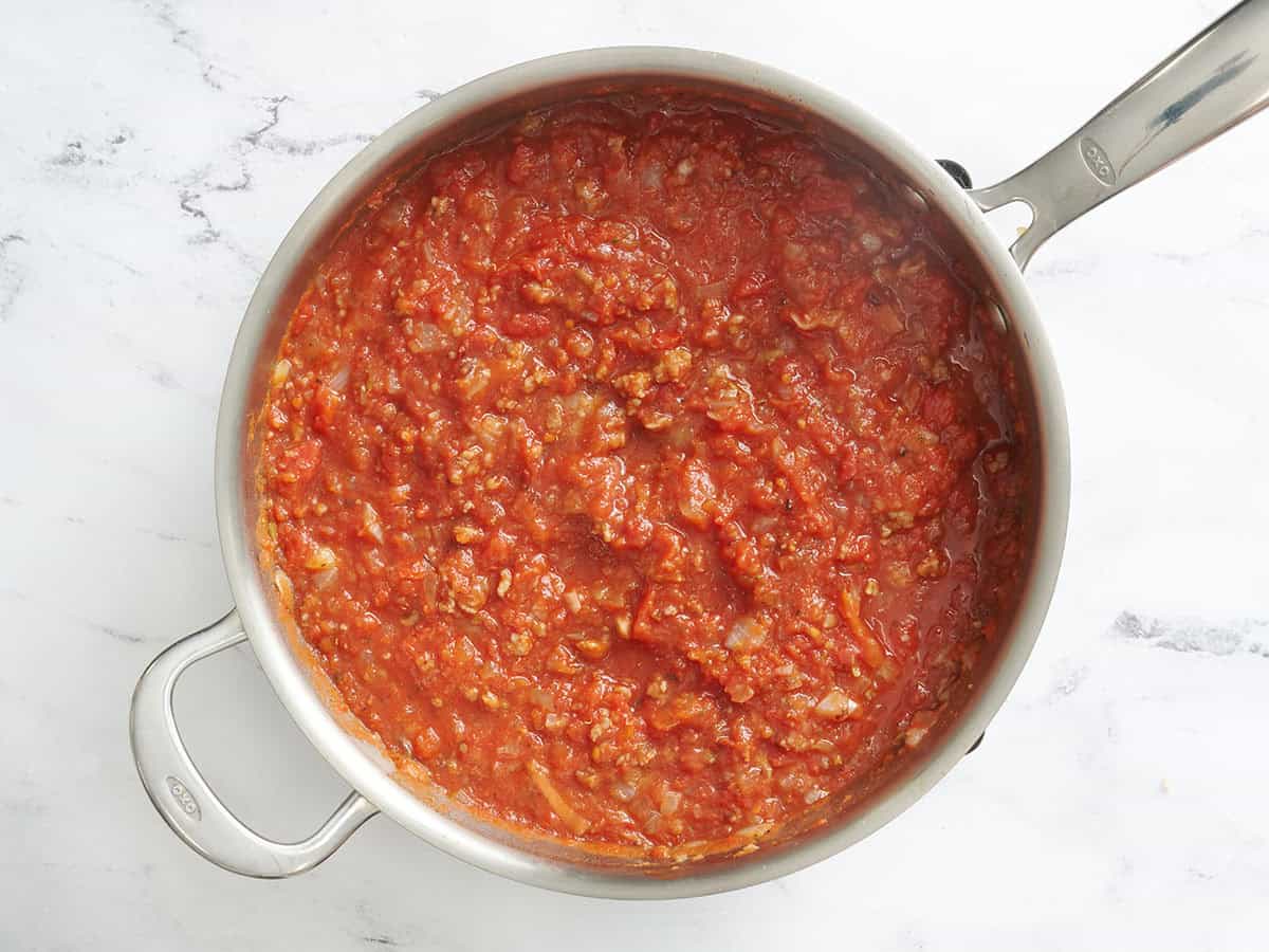 The meat sauce for baked spaghetti in a skillet.