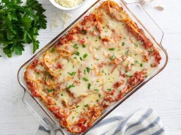 Overhead view of baked spaghetti in a baking dish.