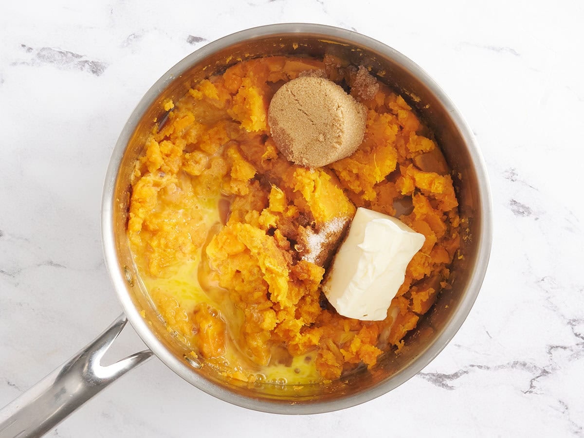 Butter, brown sugar and sweet potato in a sauce pan.