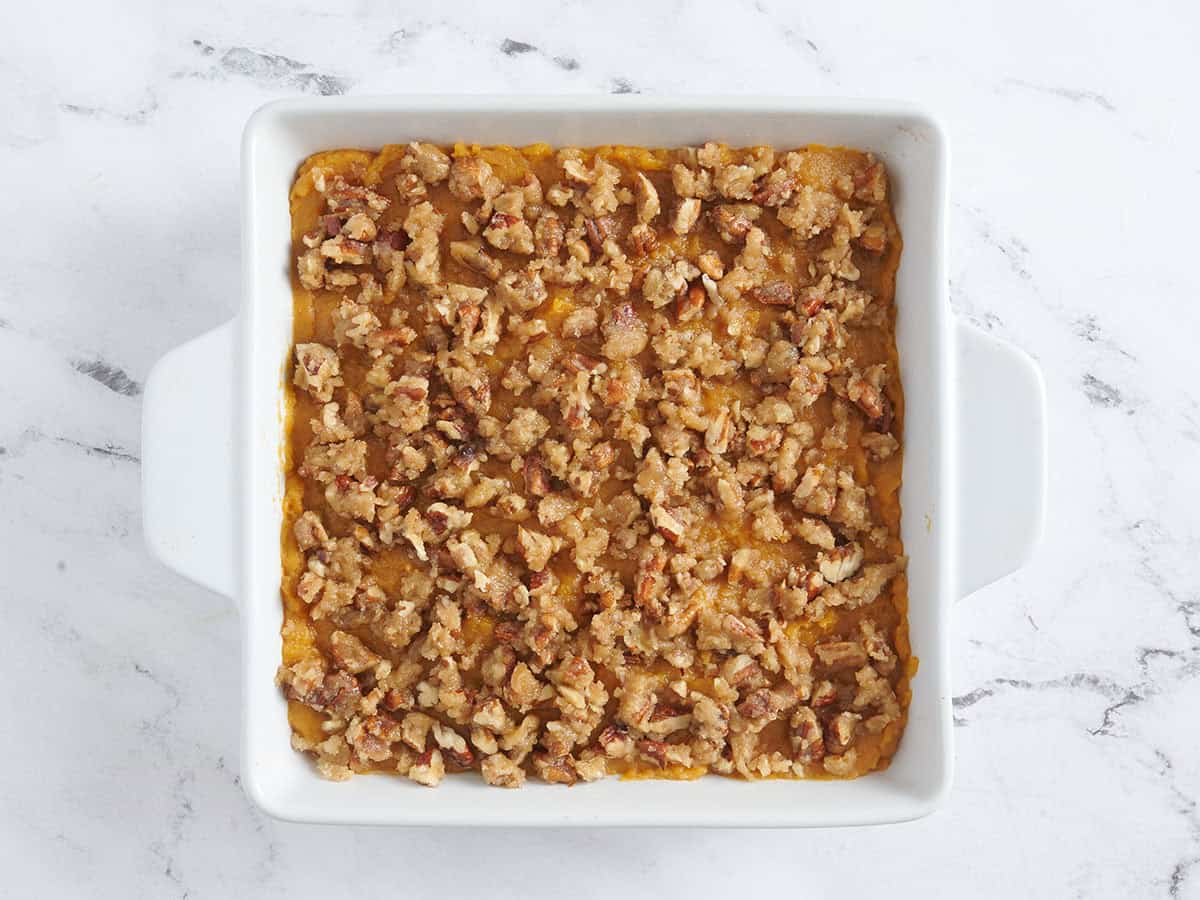 A sweet potato casserole. topped with a pecan streusel topping.