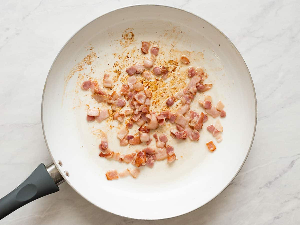 Cooked bacon in a skillet.