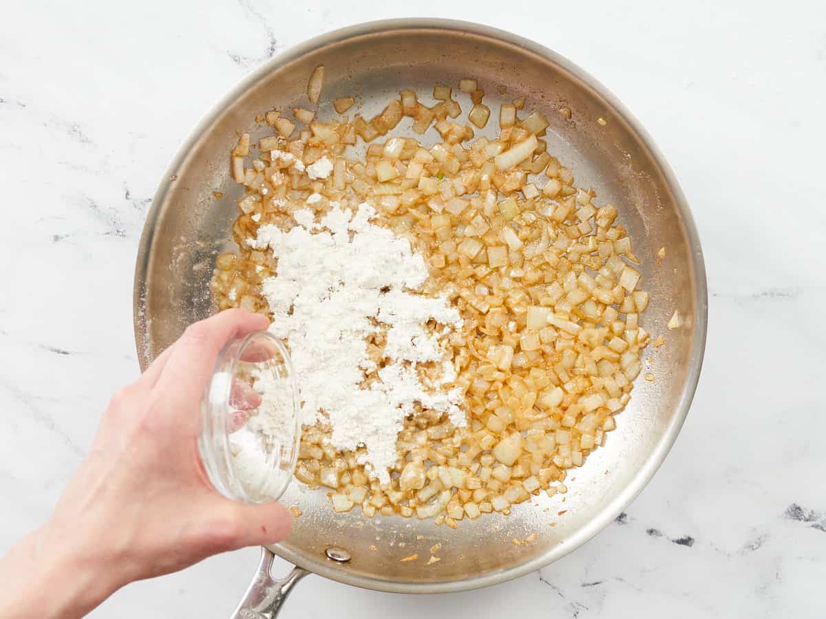 Diced onion and flour added to browned butter in a skillet.