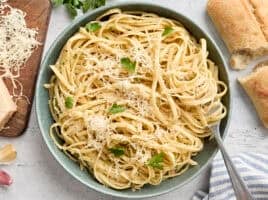 Overhead view of a plate of fettuccine alfredo with a fork.