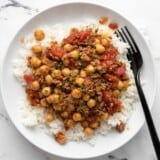 Overhead shot of Beef and Tomato Rice Bowl with fork in it.