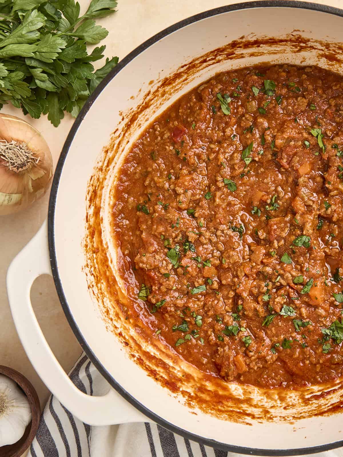 Overhead view of bolognese in a Dutch oven.