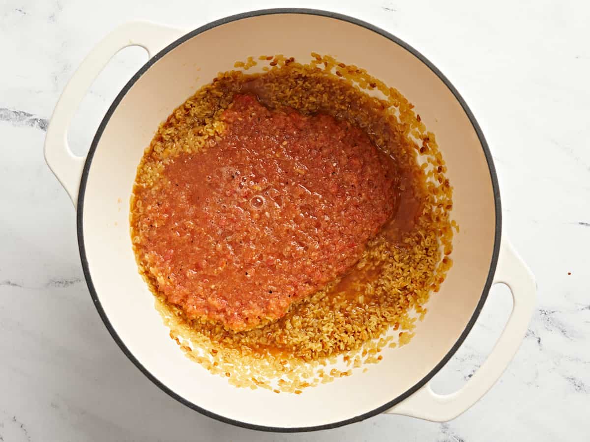 Blended vegetables added to the soup pot with the pasta.