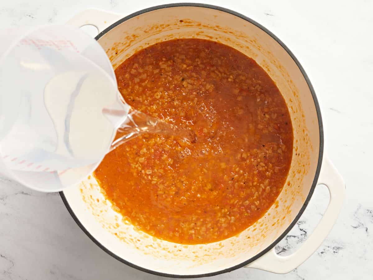 Water being added to the soup.