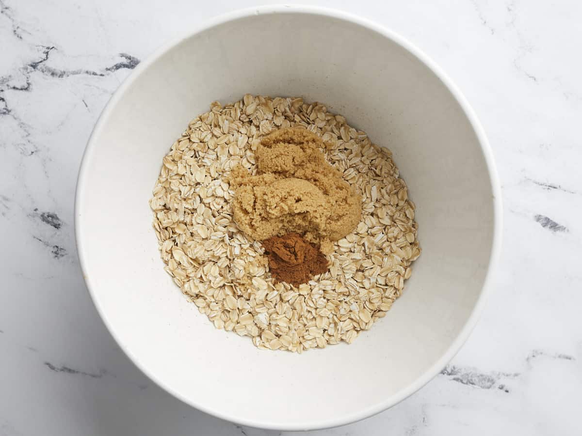 Oats mixed with cinnamon and brown sugar.