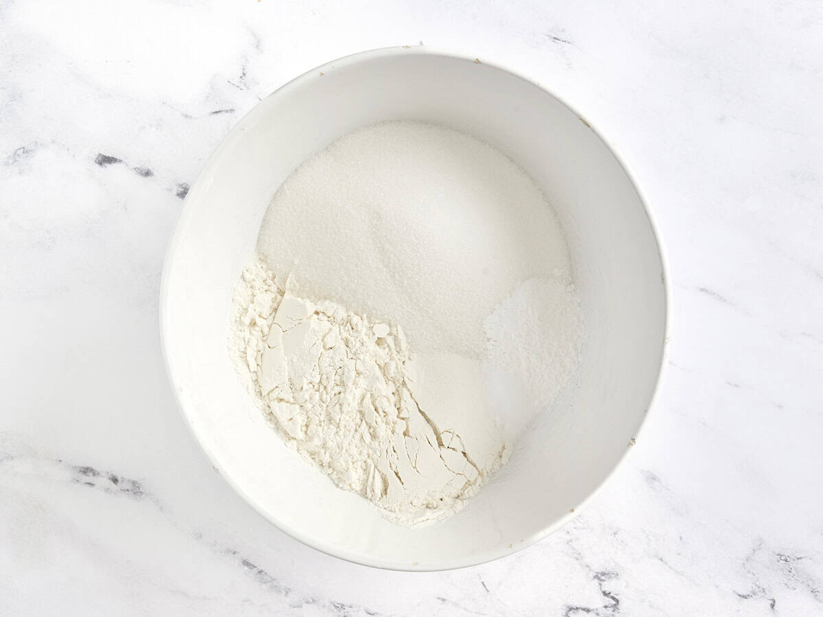 Flour, baking powder, salt, and granulated sugar in a mixing bowl.