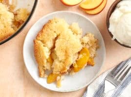 Overhead view of a plate of peach cobbler.