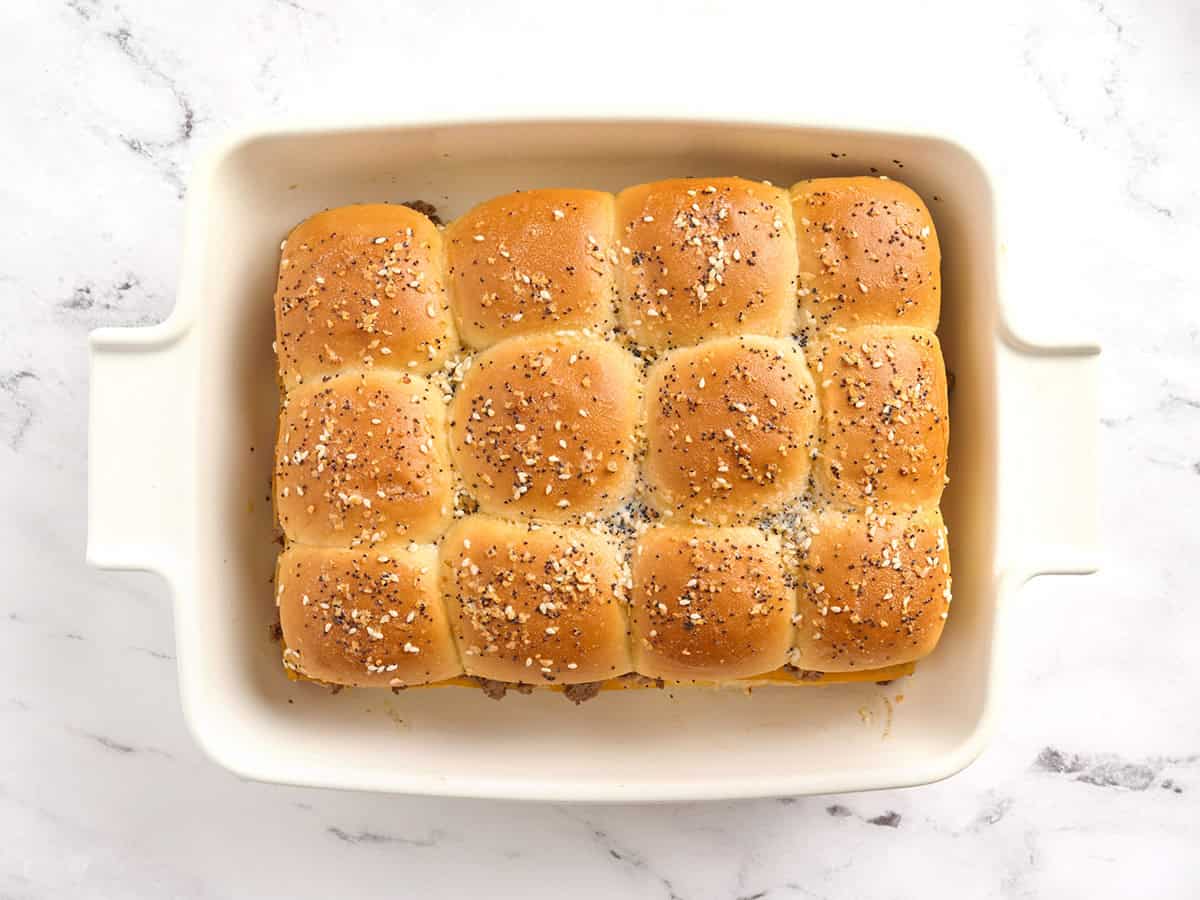 Homemade sliders fresh out of the oven in a casserole dish.