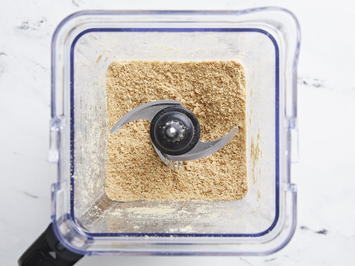 Crushed graham crackers in a blender.
