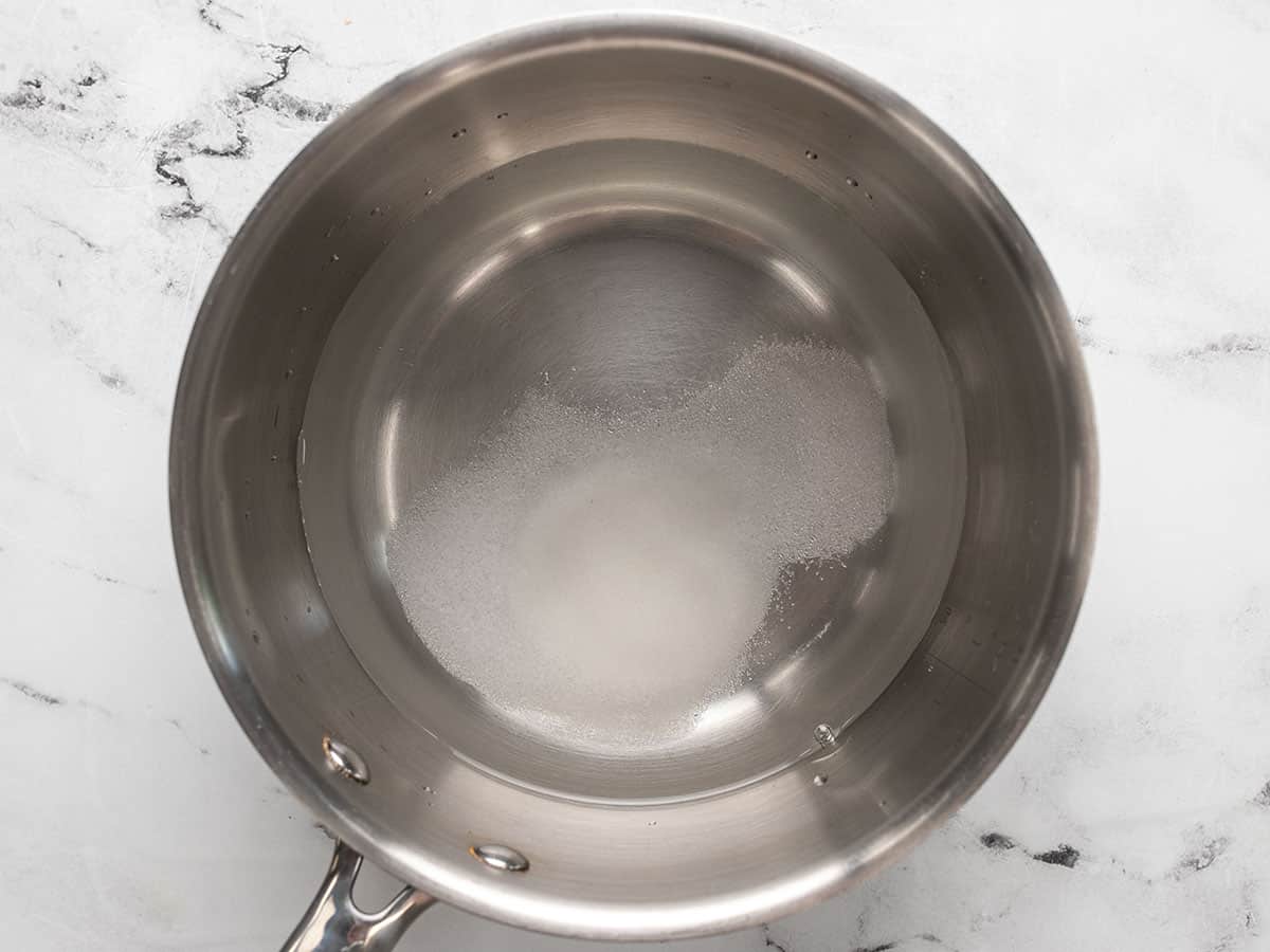 Vinegar, water, salt, and sugar in a sauce pot.