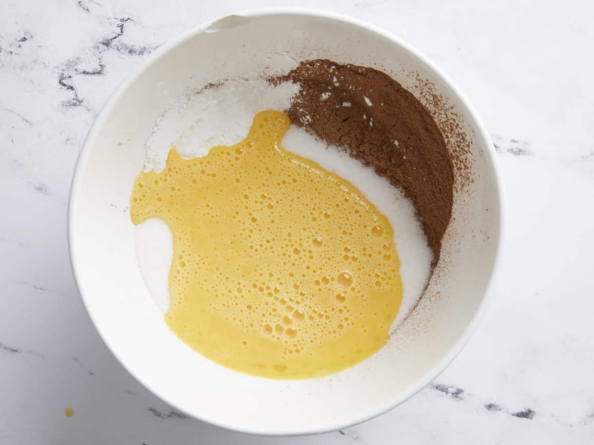 sugar, egg, and chocolate in a bowl.