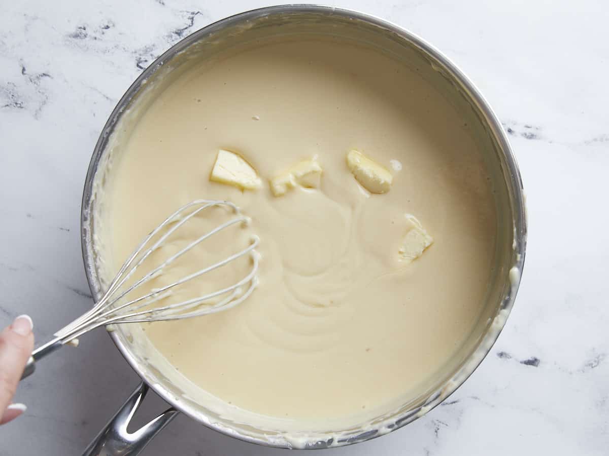 Butter being melted into the coconut custard.