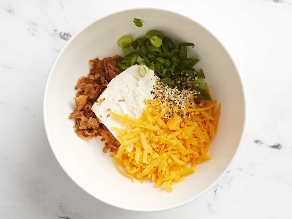 Cheese filling ingredients in a bowl, unmixed.
