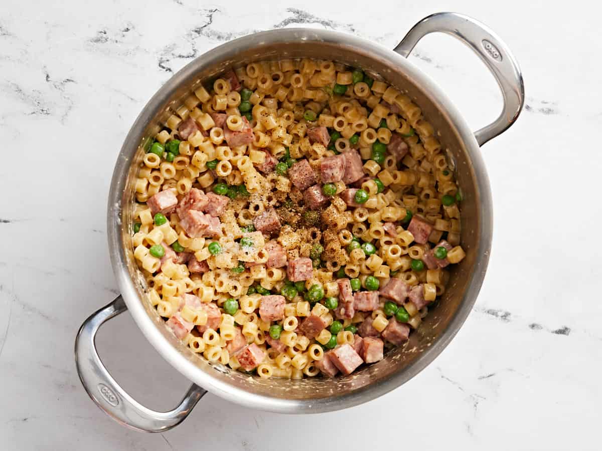 Salt and pepper added to the pasta.