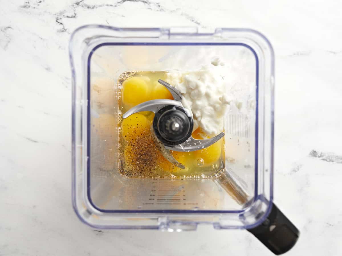 Eggs and cottage cheese in a blender.