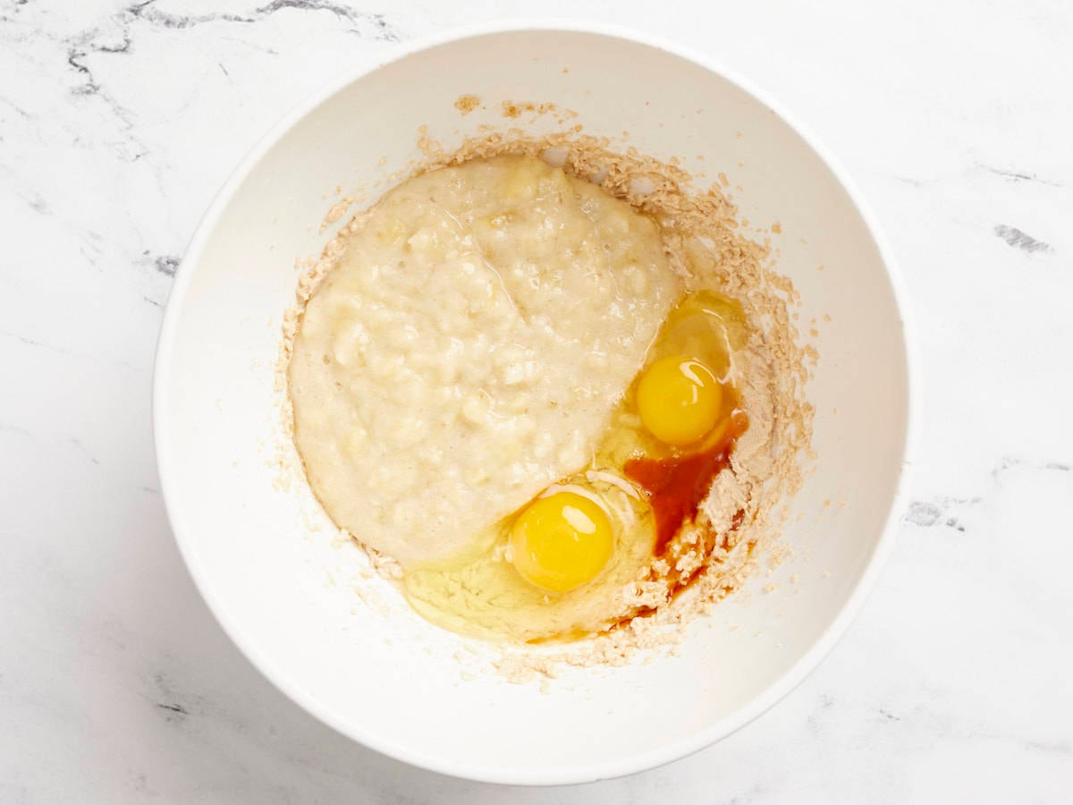 Banana, eggs, and vanilla added to the butter and sugar mixture.