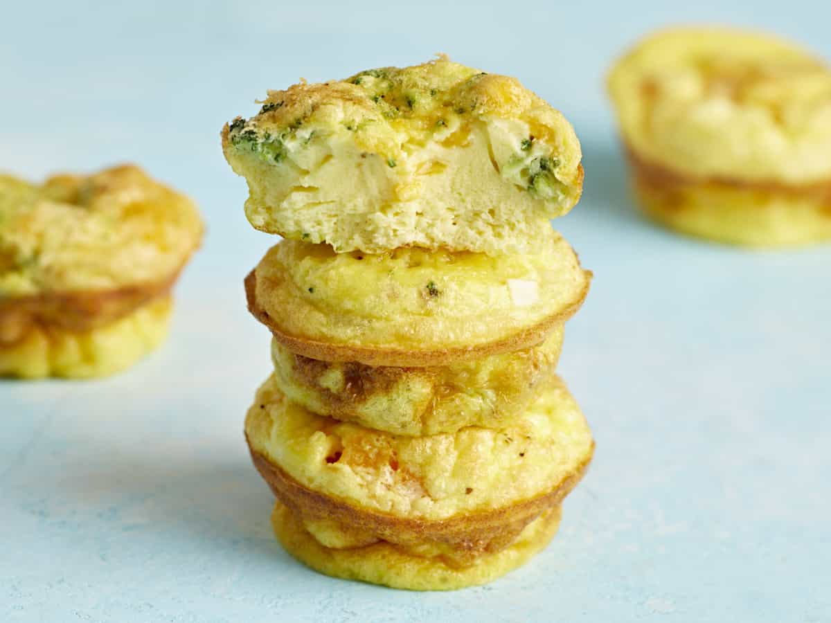 A stack of egg muffins on a blue background.