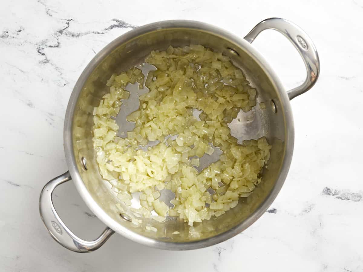 Sautéed onion and garlic in a saucepot.