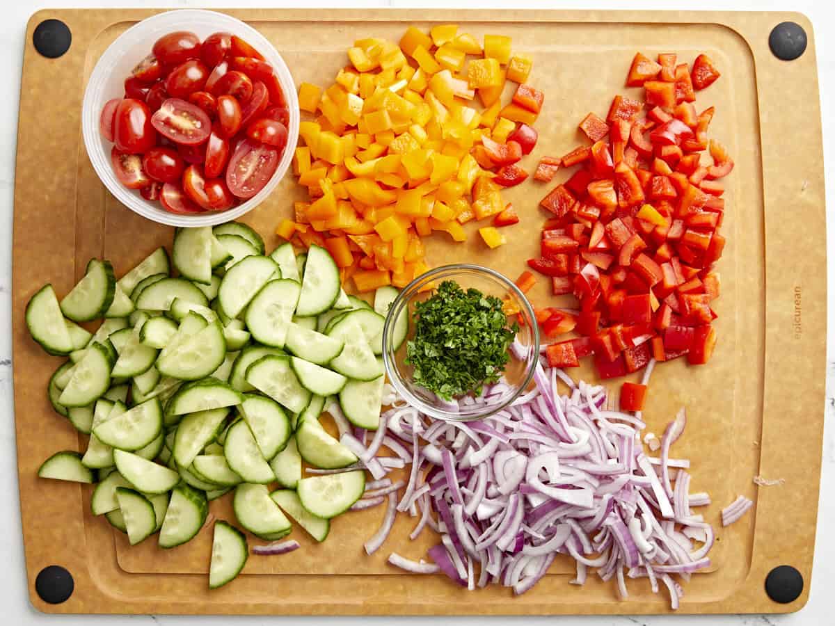 Chopped vegetable ingredients on a cutting board.