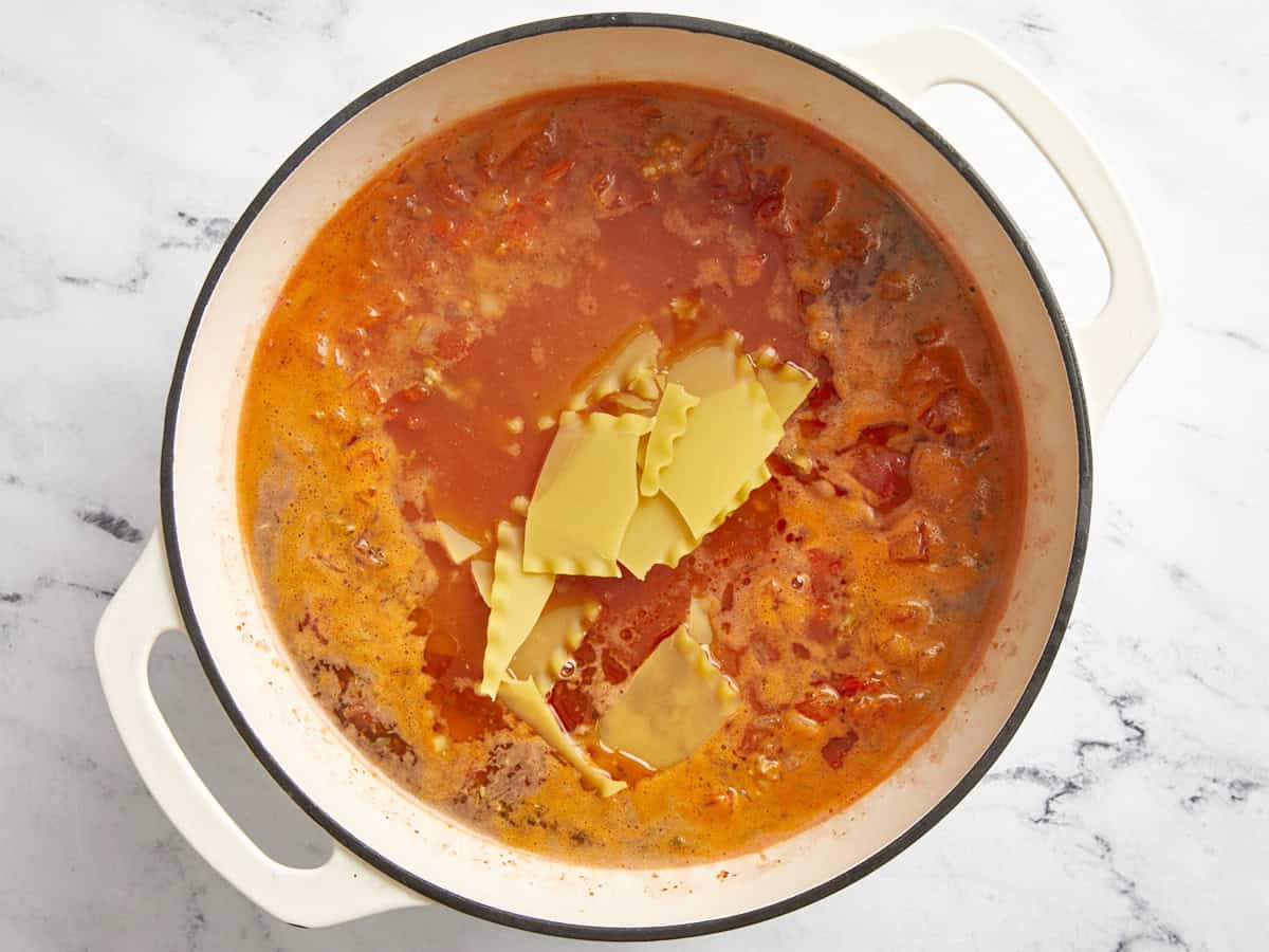 Lasagna noodles added to soup pot.