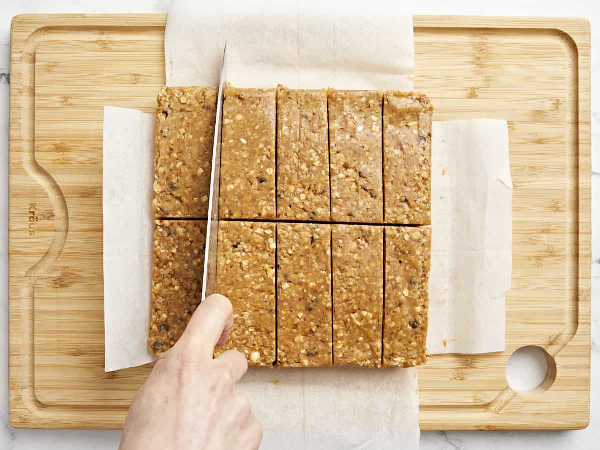 cutting granola bars on a cutting board.